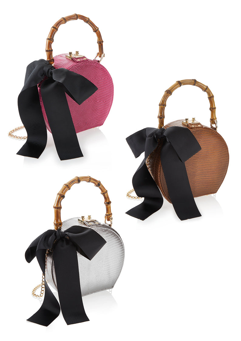 CLUTCH IN ECOPELLE CON FIOCCO IN STOFFA